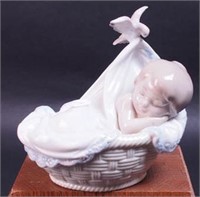 Lladro figurine of baby sleeping in