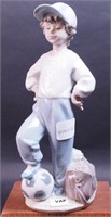 Lladro figurine of young soccer player,