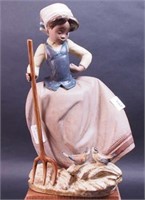 Lladro figurine of girl with pitchfork