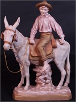 Royal Dux figurine of boy riding donkey,