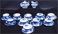 10 non-matching flow blue cups and saucers,