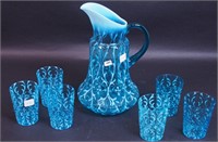 A seven-piece blue opalescent water set,