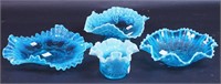 Four pieces of blue opalescent glass,