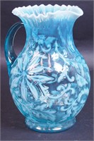 A blue opalescent water pitcher with