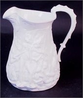 A white Parian ware pitcher of French