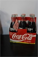 6/pk of full Coca Cola bottles