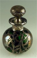 Antique emerald glass scent bottle with floral