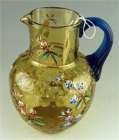Hand blown amber thumb print pitcher with hand