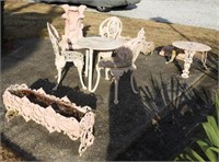 Pink garden furniture and statuary lot to