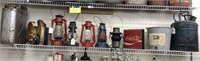 Shelf full vintage lanterns & gas cans