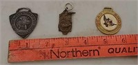 Two watchfobs and one shooting medal
