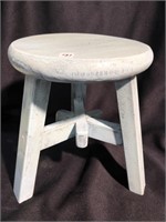 Vintage three legged milking stool that has been