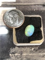Cabochon opal with lots of brilliant fire in