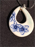 Handmade porcelain pendant on cord with the