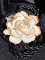 Handmade porcelain flower pendant on cord