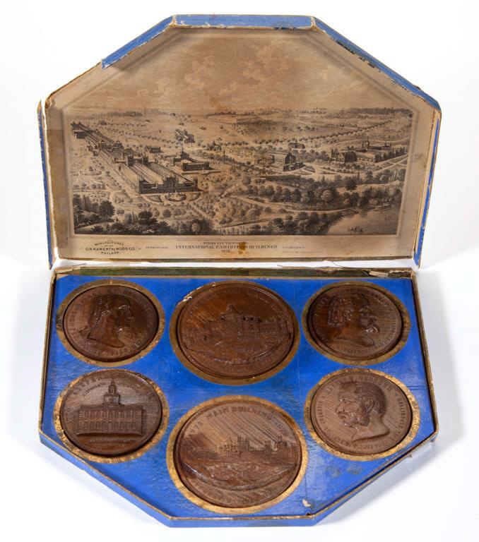 Centennial Exposition boxed set of carved wooden medals