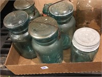green glass jars with glass lids
