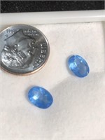 Faceted matched pair of oval blue topaz