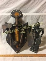 Medieval metal knight statue and weapons shield