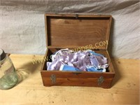 Antique wooden box with doll clothes