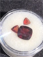 Faceted square ruby and two small ones