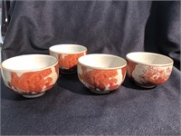 Set of four Asian tea cups