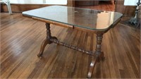 Glass covered small coffee table