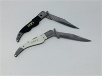 Pair of fold out knives LION
