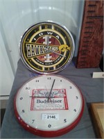 2 battery powered clocks--Hawkeys, Budweiser