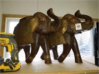 2 wooden elephants one broken trunk