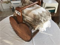 Wooden basket of linens/doilies