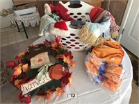 Fall wreath/holiday decorations in laundry basket