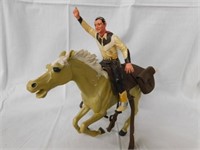 Cowboy on horseback, complete with saddle