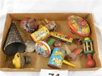 Several old metal toys: tops - wind ups-