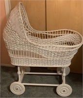White Woven Baby Bassinet With Wooden Wheels