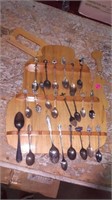 Collector spoons in tea pot case