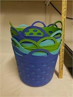 Group of blue and green plastic storage baskets