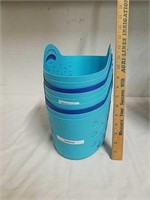 Group of blue plastic storage baskets