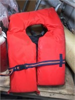 Four Life Vests/Jackets and  Boat Ladder