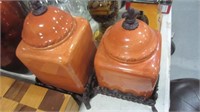PAIR OF CERAMIC CANISTERS WITH METAL STANDS