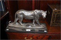 Silver painted resin figurine of a cheetah