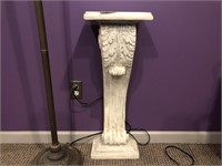 Ornate pedestal made of plaster