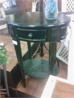 Oval black side table with drawer