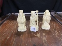 3 carved statues