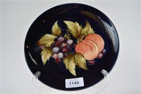 Moorcroft pottery plate, 'Peaces and Grape'