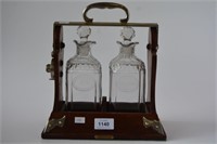 Antique oak bound 2 decanter tantalus, made by