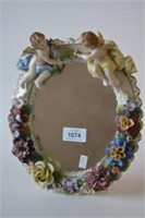 Antique porcelain framed oval mirror,
