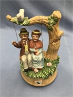 Grandma and Grandpa on swing musical ceramic