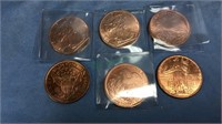 Group of 6 one ounce copper coins, that look like