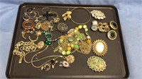 Tray lot of costume jewelry , brooches, black